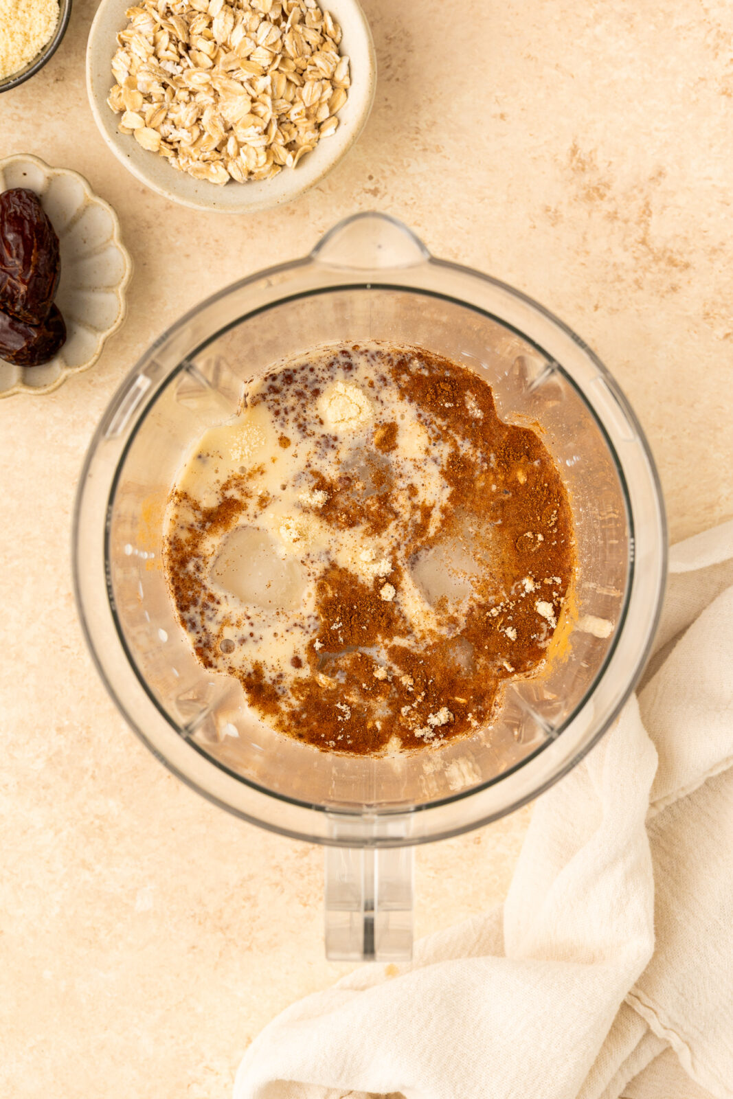 oatmeal cookie smoothie ingredients in a blender