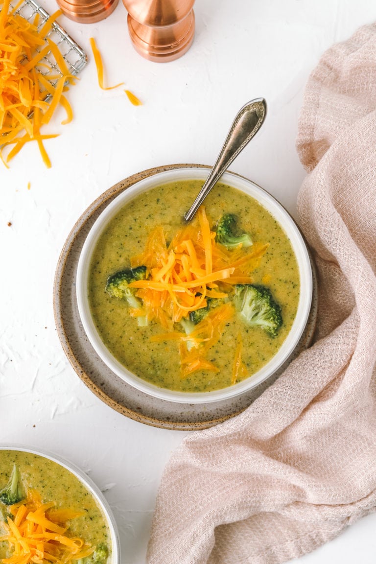 spoon in a bowl of broccoli cheddar soup