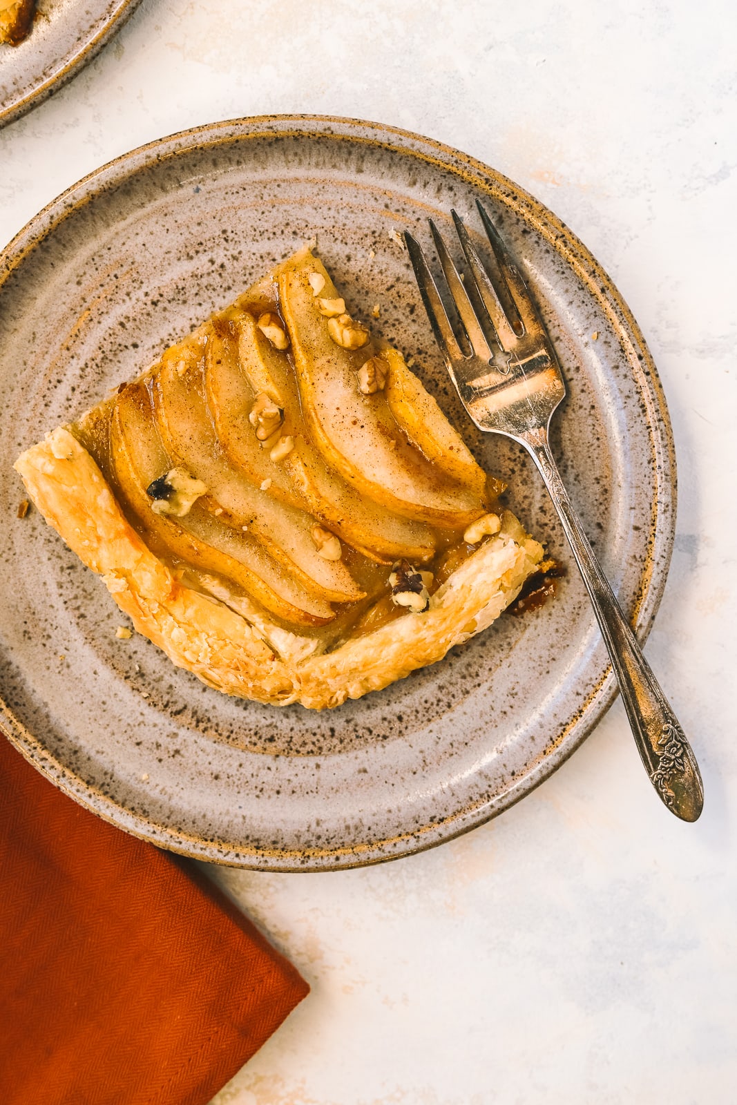 a piece of pear tart on a plate