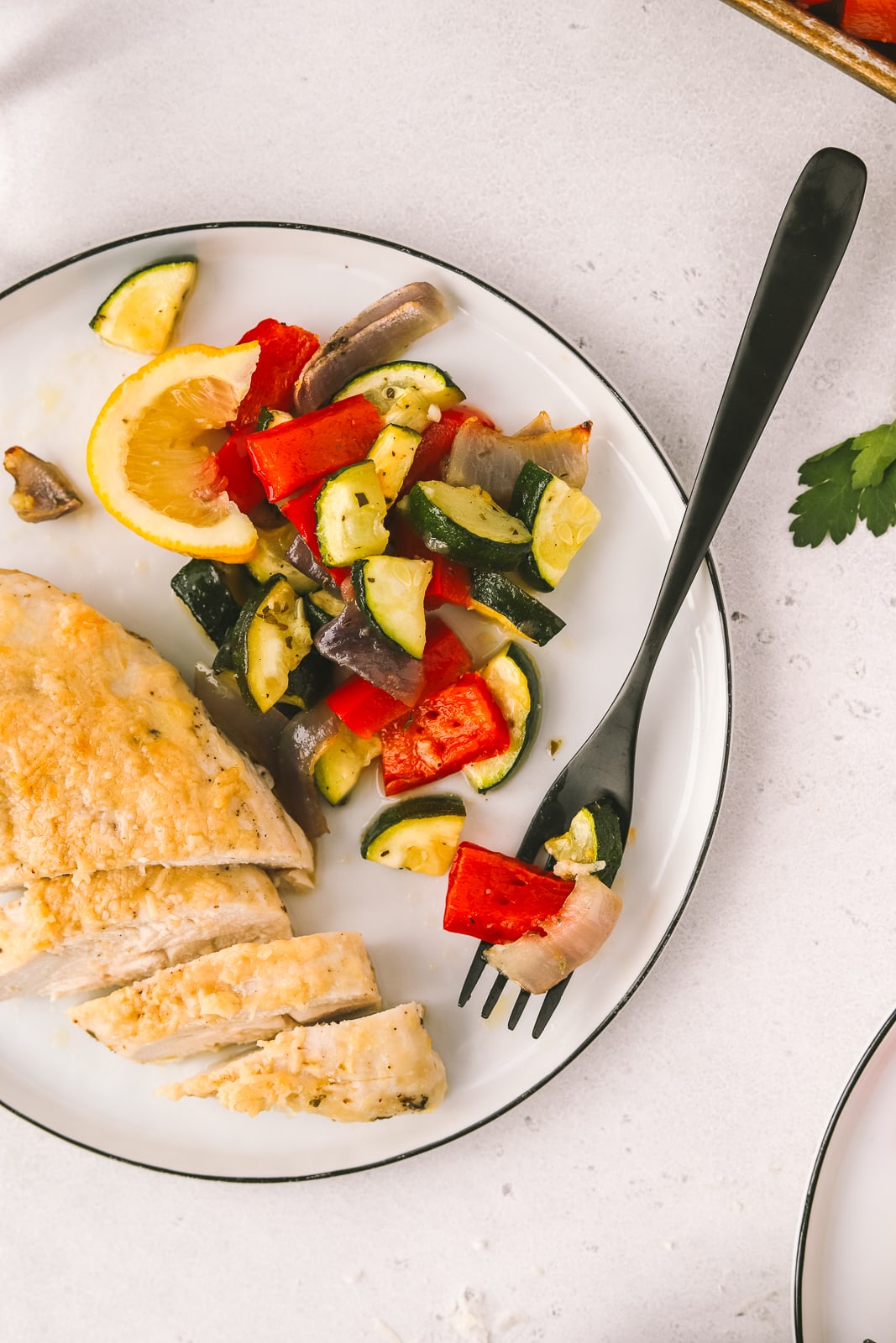 vegetables and chicken on a dinner plate