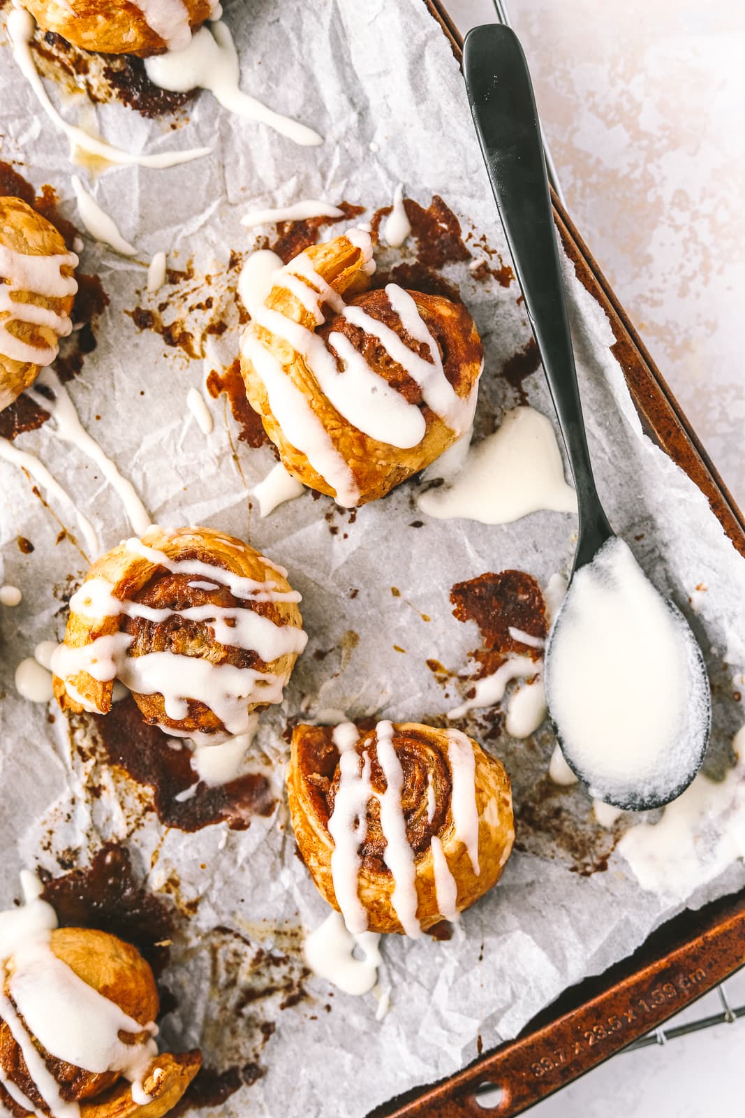 mini cinnamon rolls on a baking sheet