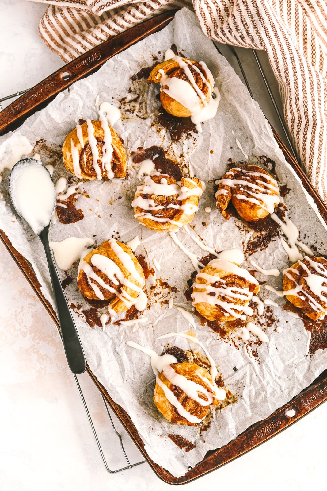 mini cinnamon rolls on a baking sheet