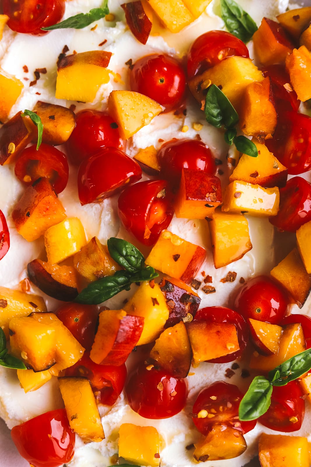 peaches and tomatoes with goat cheese served on crostini