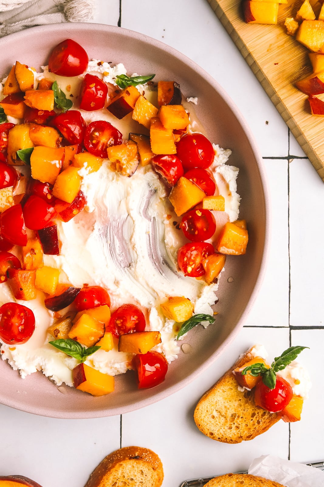 peaches and tomatoes with goat cheese served on crostini