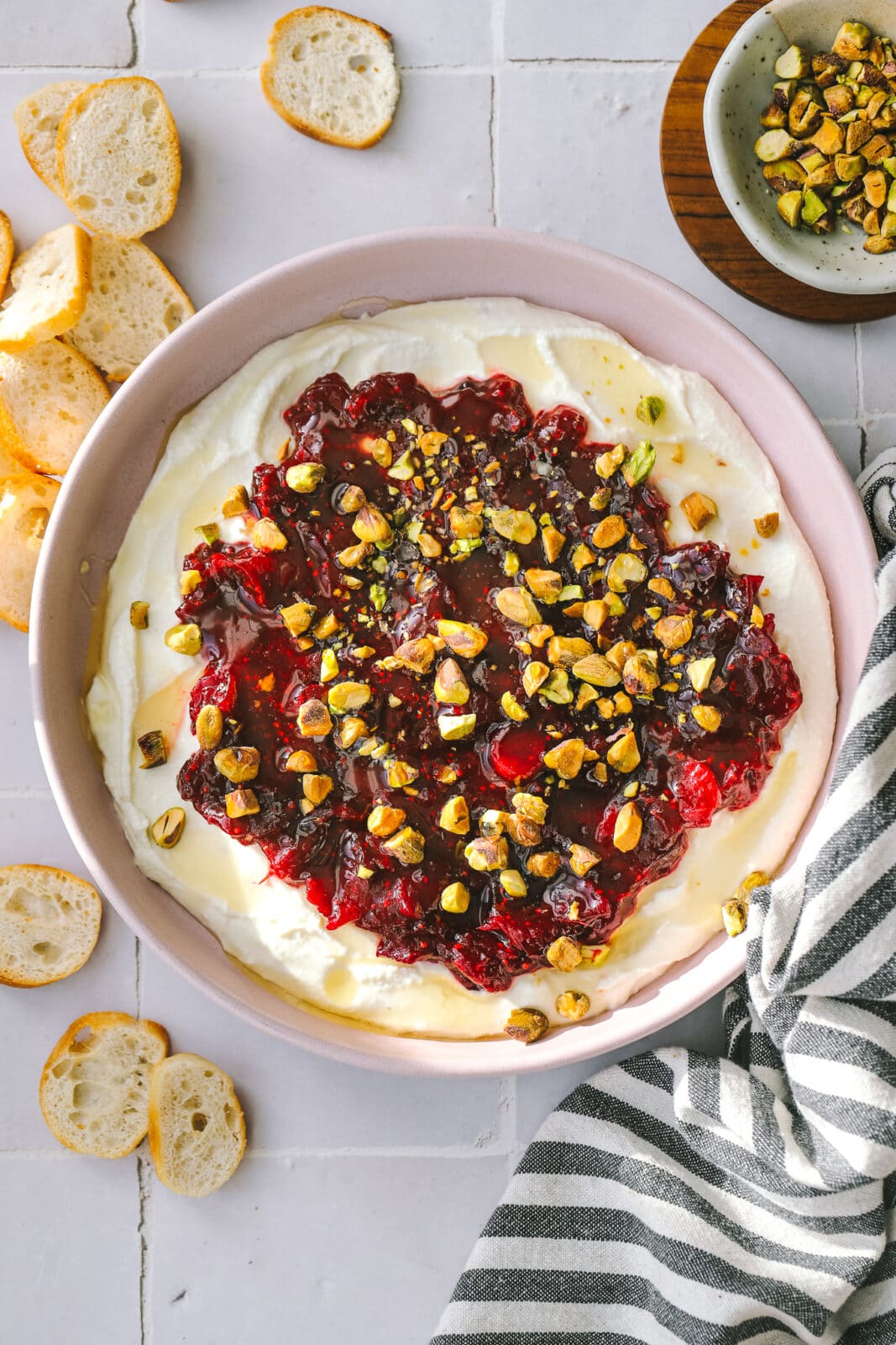 cranberry whipped feta dip in a pink bowl