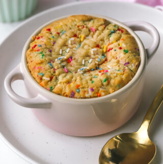 side angle of baked single serving sugar cookie in a ramekin