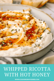 angled close up shot of hot honey and walnuts on ricotta