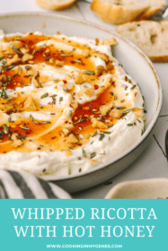 angled close up shot of hot honey and walnuts on ricotta