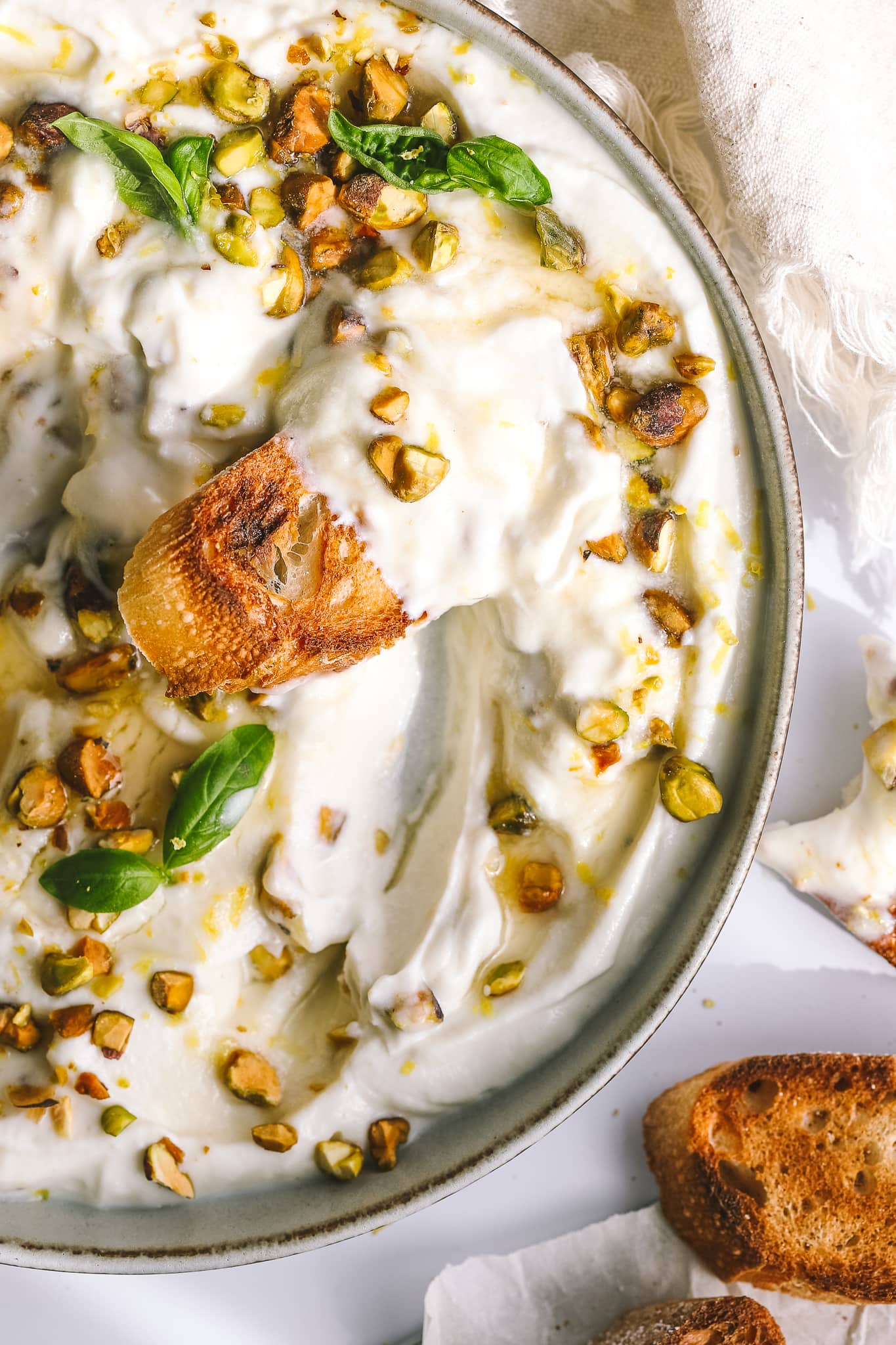 overhead of whipped ricotta with bread slice