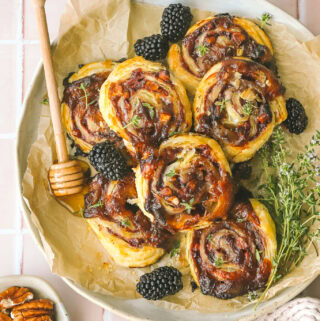 blackberry puff pastry pinwheels on a plate