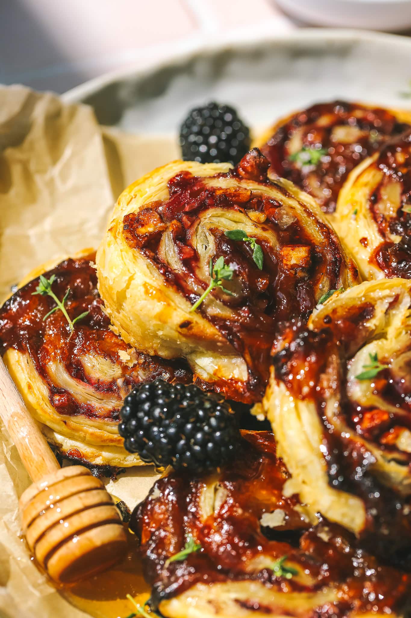 blackberry puff pastry pinwheels on a plate