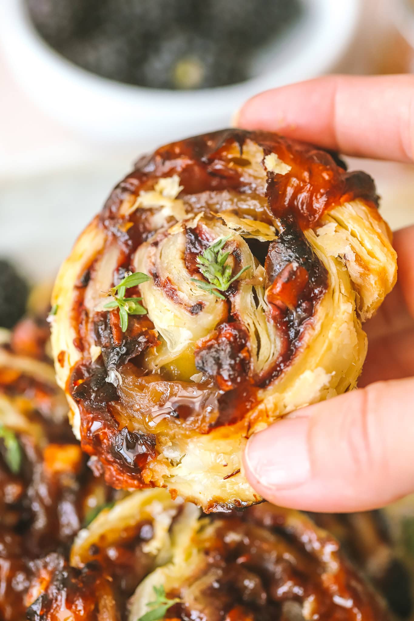 closeup of blackberry puff pastry pinwheel