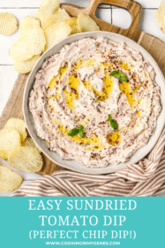 sundried tomato dip in a serving bowl with chips