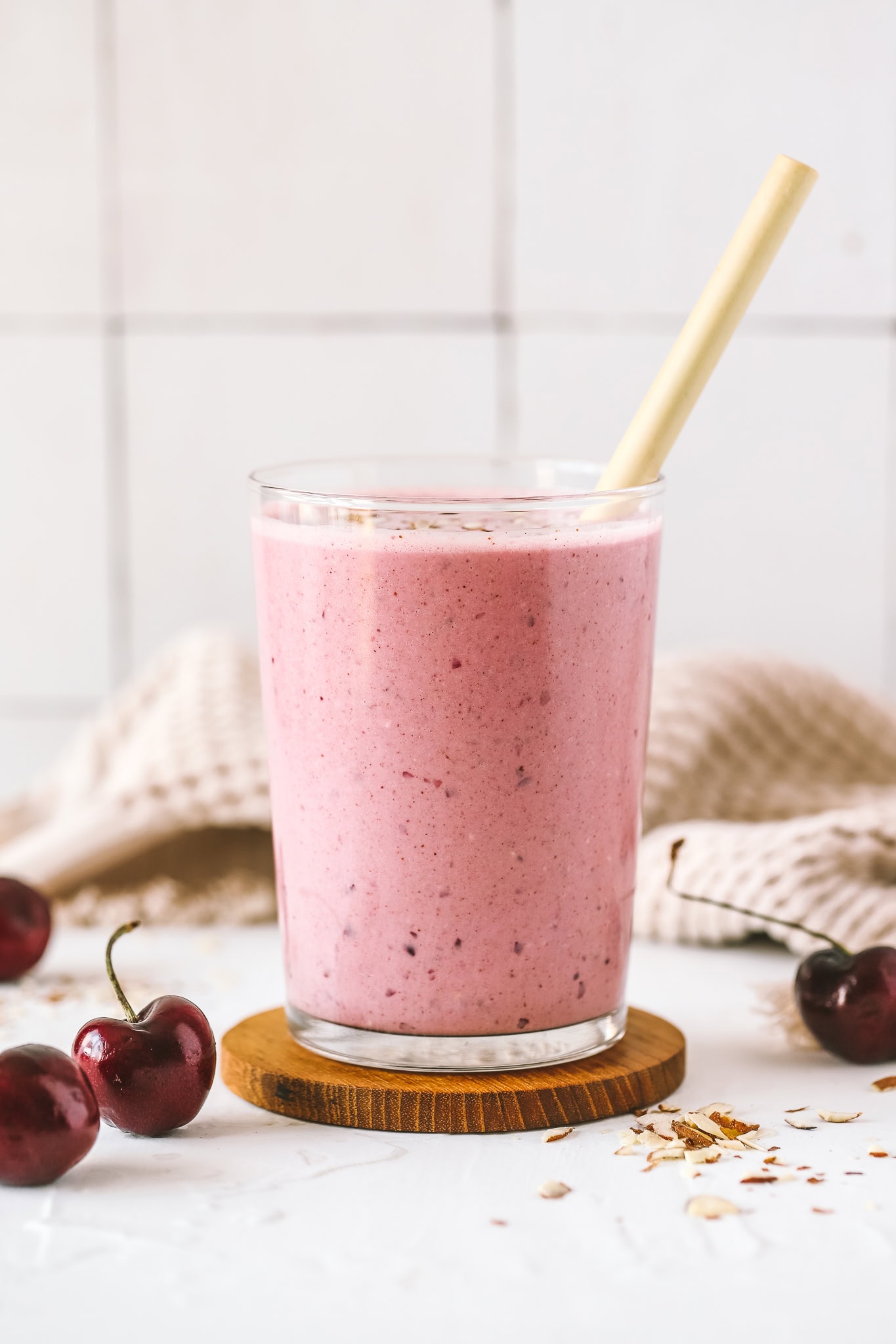 cherry pie smoothie with a straw in the glass
