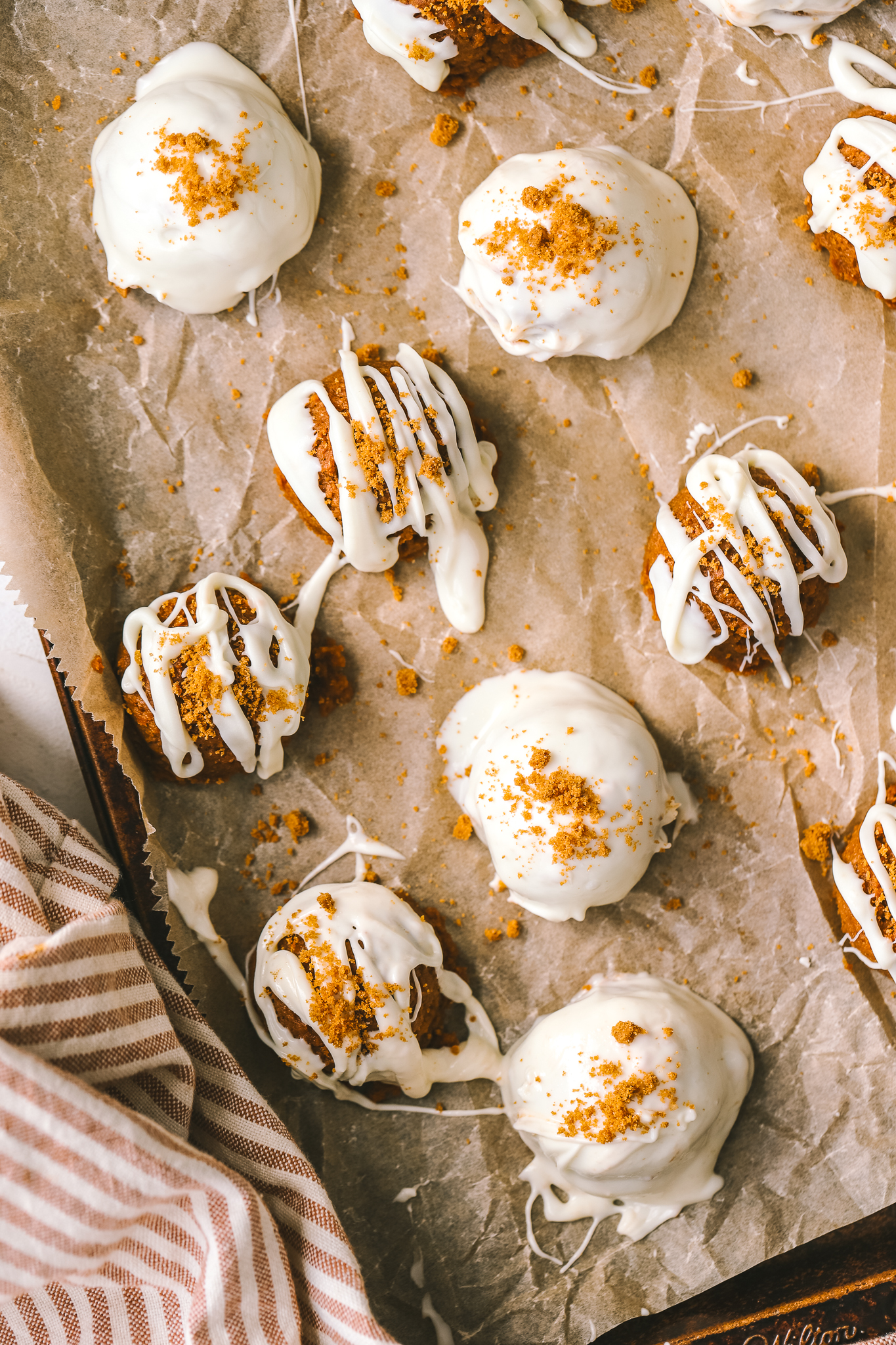 no bake pumpkin truffles decorated with white chocolate
