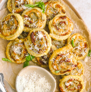 tray full of pesto pinwheels