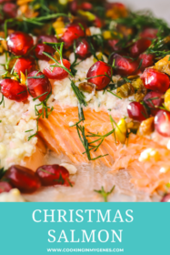 close up of baked salmon with pomegranate seeds, dill and pistachios