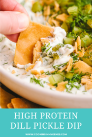 hand dipping pita chip into dill pickle dip
