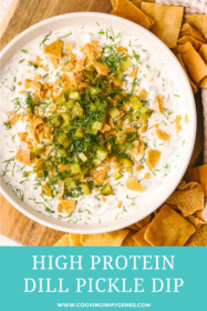 high protein dill pickle dip in a bowl served with pita chips