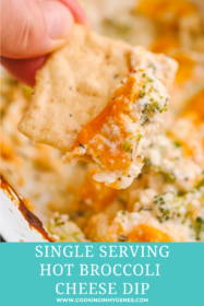cracker dipped into broccoli cheese dip
