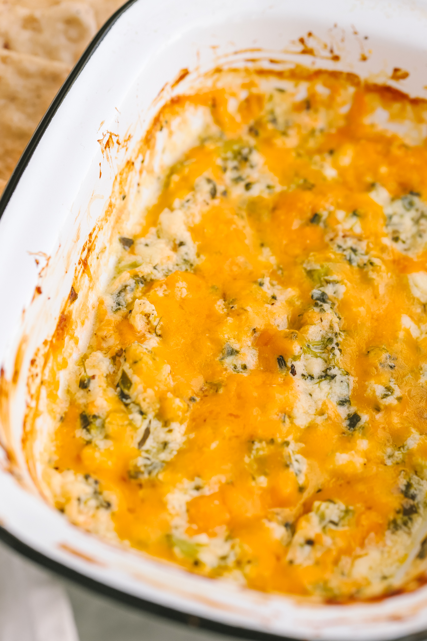 hot broccoli dip in a single serving baking dish