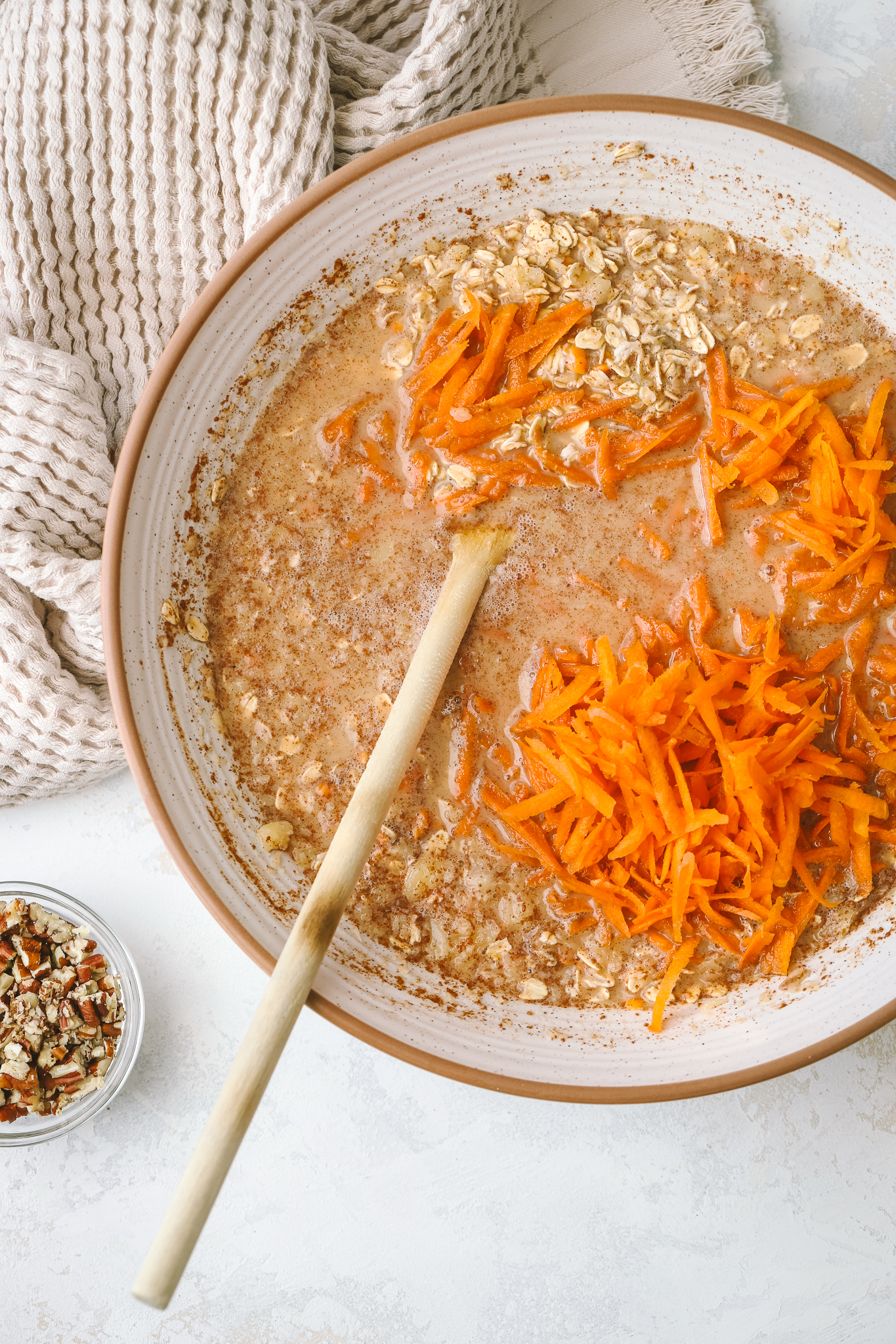 carrot cake oatmeal mixture in a mixing bowl