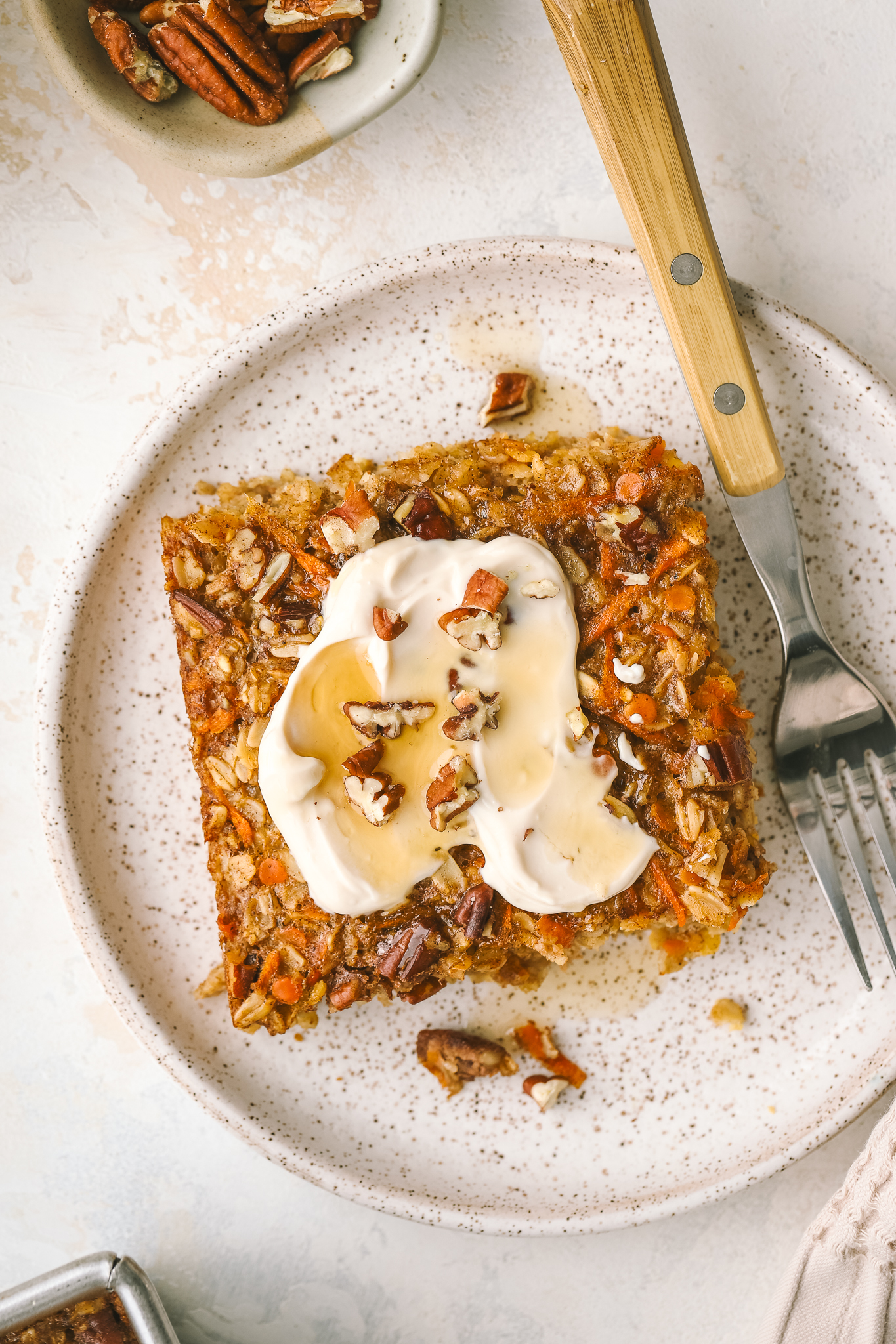 close up of cream cheese icing on baked oats