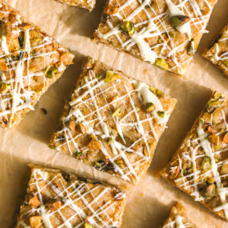 white chocolate pistachio blondies on parchment paper