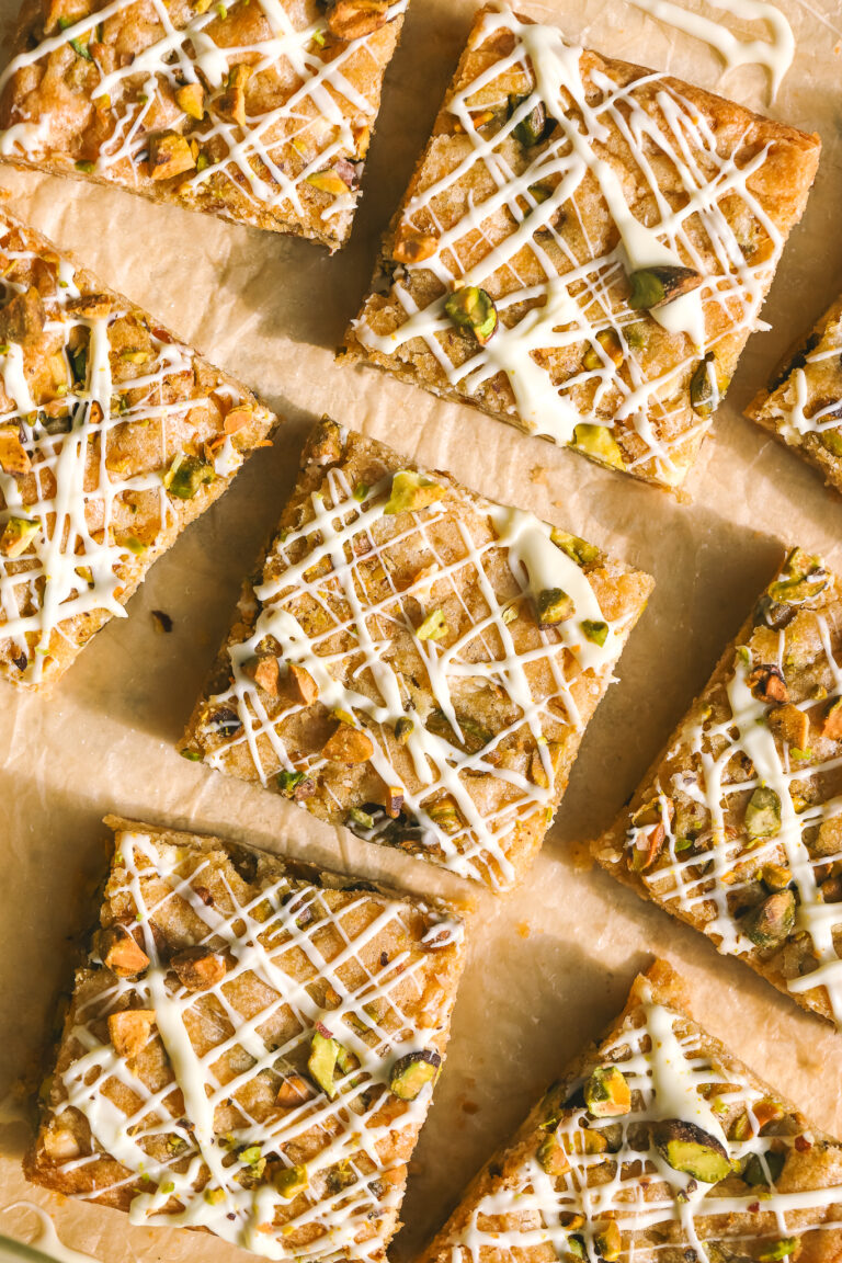 white chocolate pistachio blondies on parchment paper