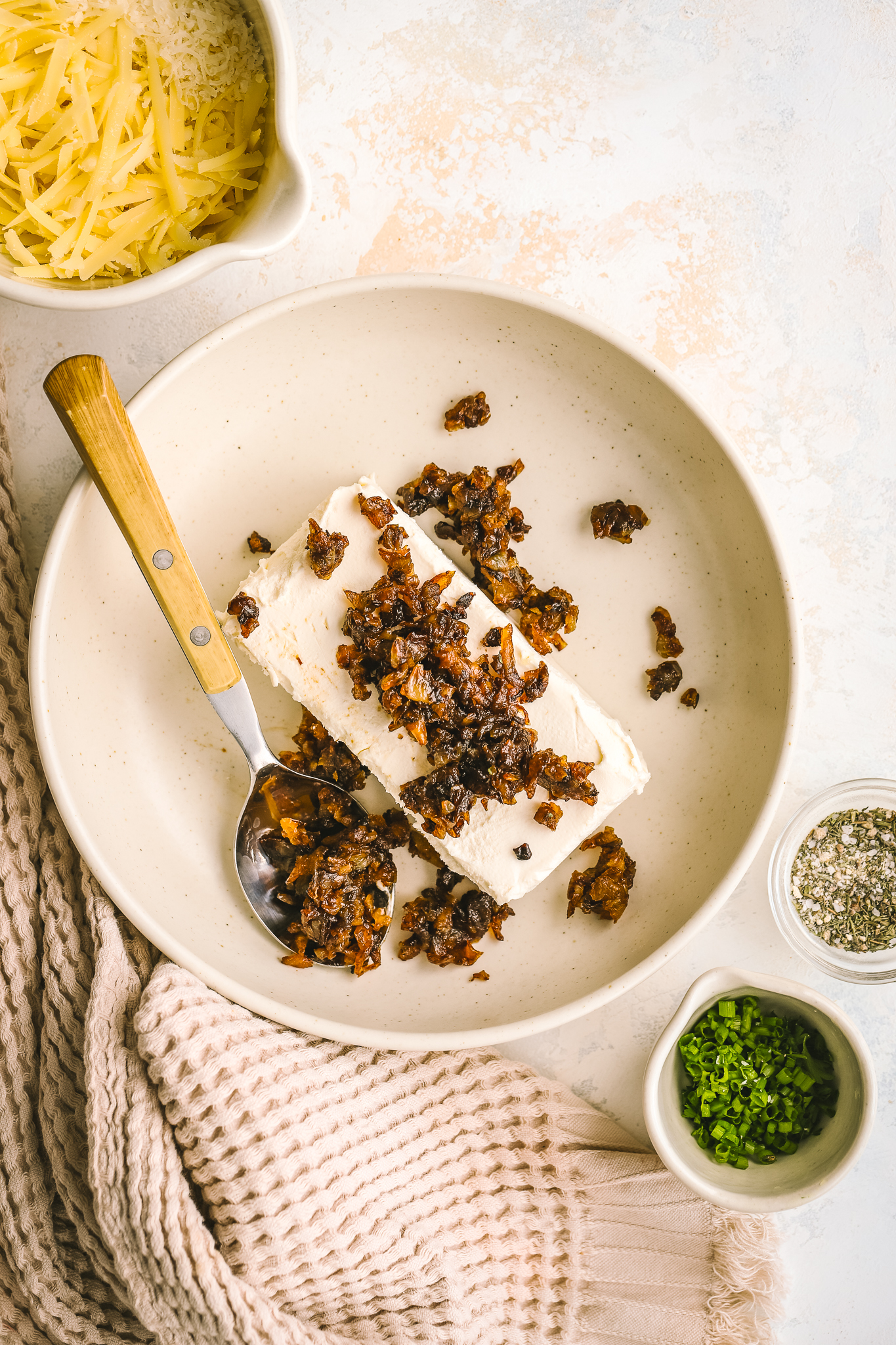 caramelized onions with cream cheese in a bowl
