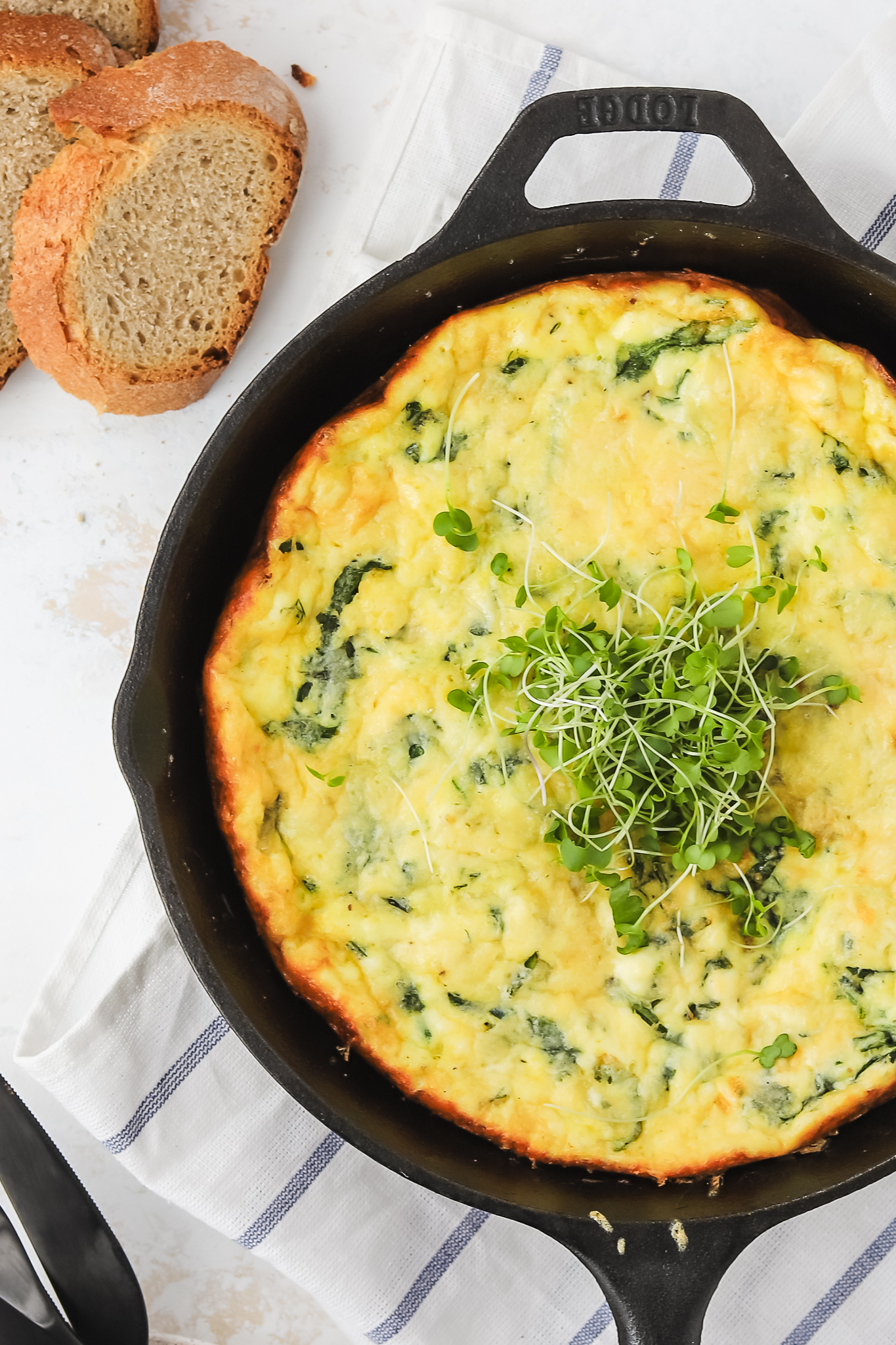 close up of frittata with herbs on top