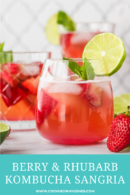 berry rhubarb kombucha sangria in a glass garnished with lime and fresh mint