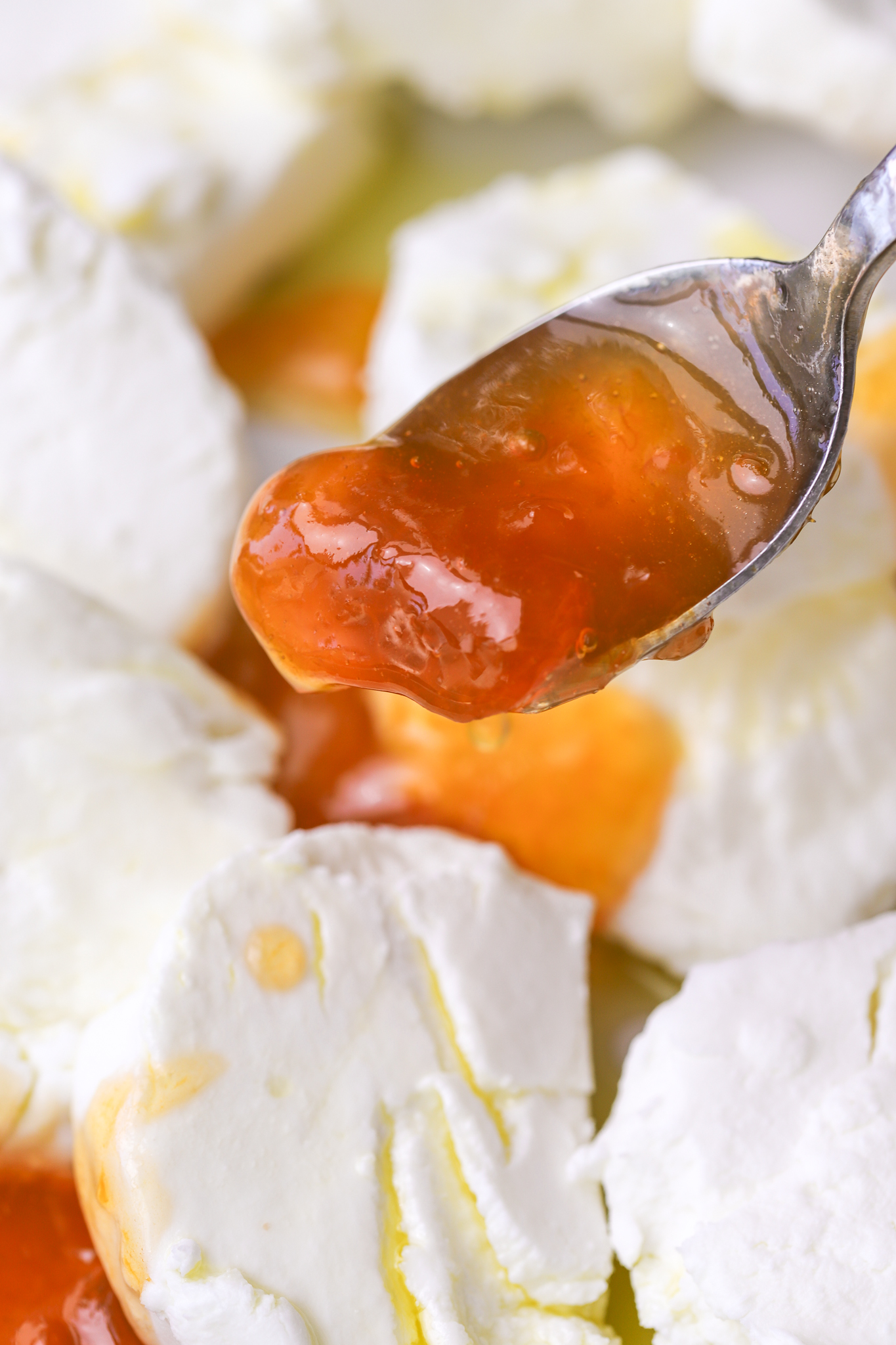 spoon with apricot jam on it