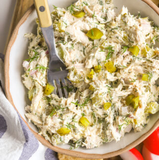spoon in a bowl of chicken salad