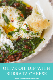 bread dipped into burrata and olive oil with herbs