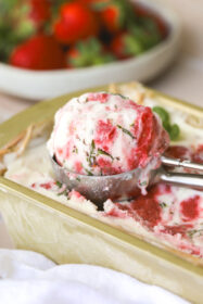 strawberry basil ice cream in an ice cream scoop