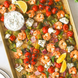 cooked shrimp and vegetables on a sheet pan