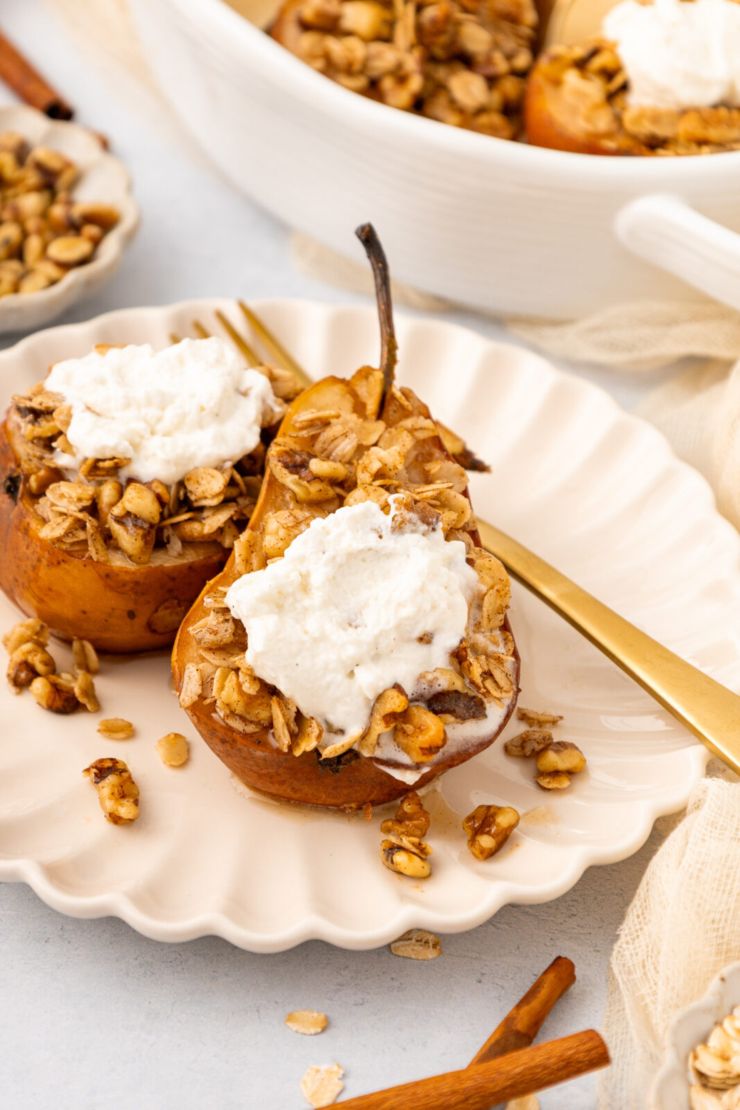 baked pears with cardamom cream on a plate
