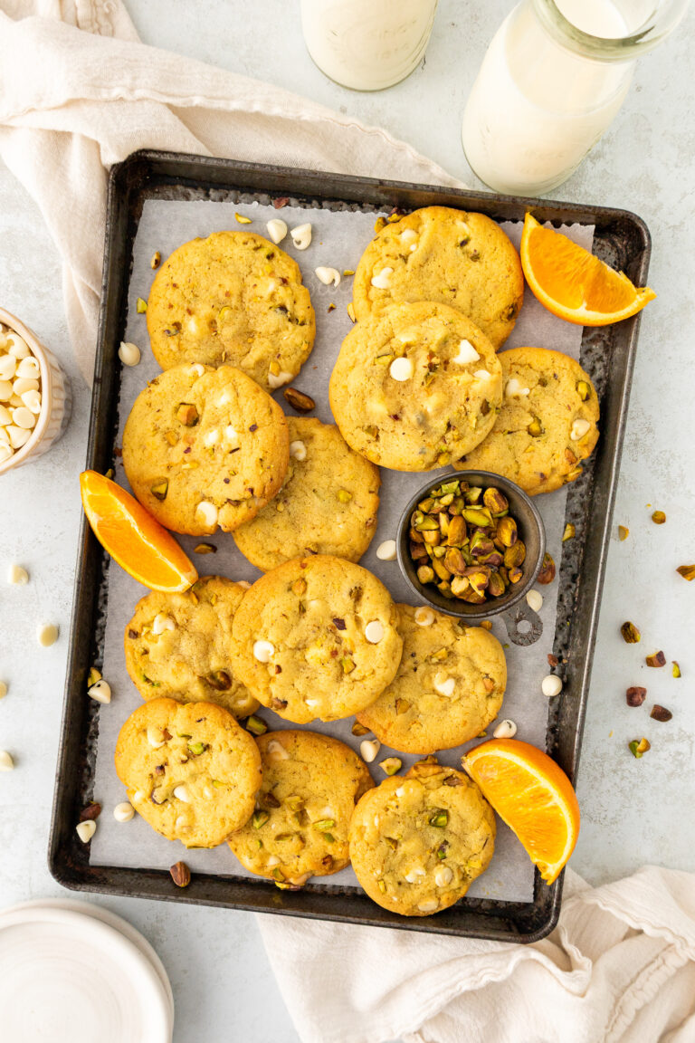 orange pistachio white chocolate cookies on a baking sheet