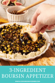 cracker dipping into boursin appetizer