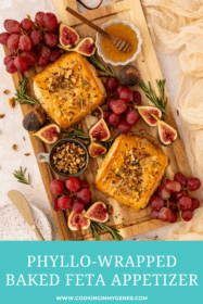 phyllo-wrapped baked feta appetizer on a serving board with seasonal fruits