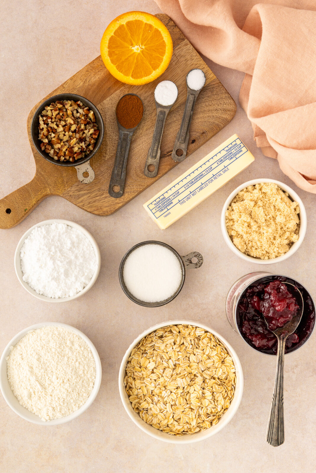 all of the cranberry oat crumble bar ingredients in a bowls and temperature
