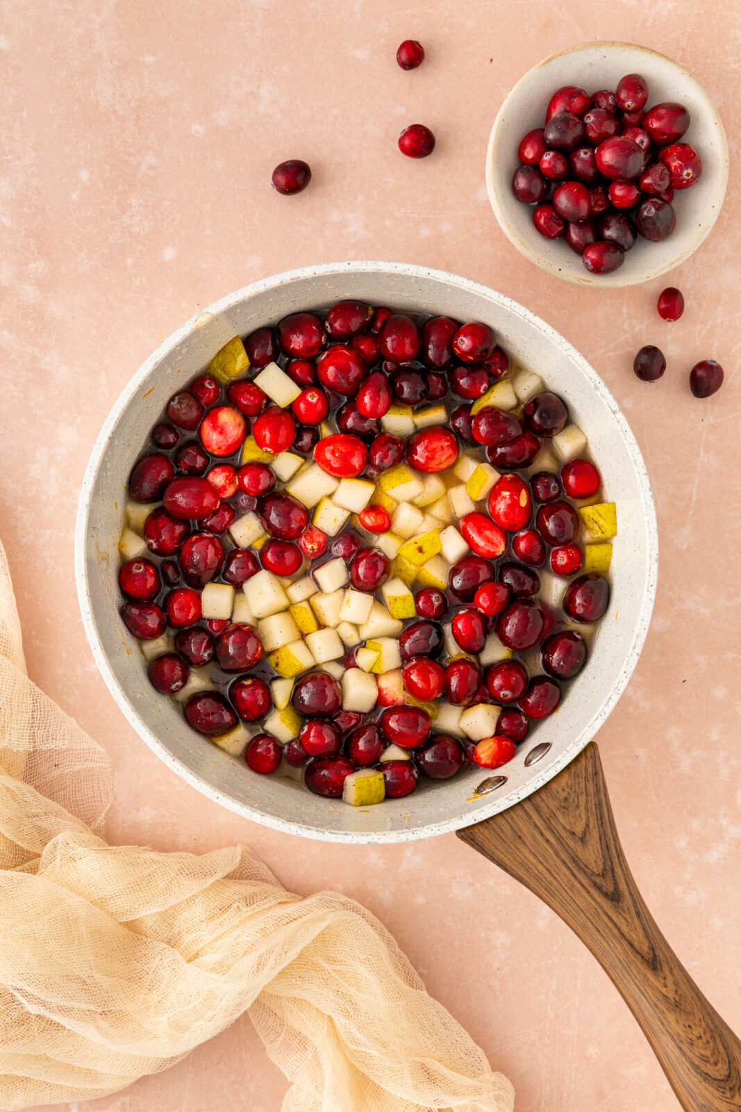 cranberries and pears in a saucepan