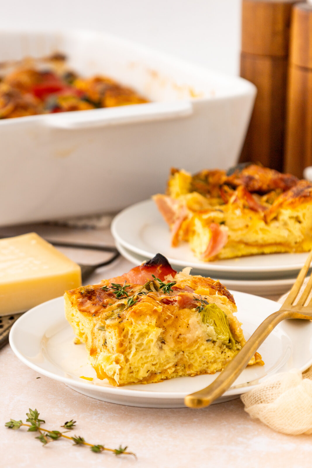 piece of ham and cheese breakfast casserole on a plate