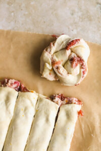 puff pastry swirl with goat cheese on parchment paper