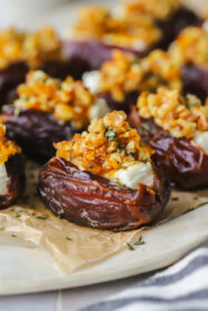 feta stuffed dates on a serving tray