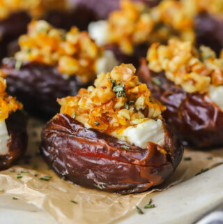 feta stuffed dates on a serving tray