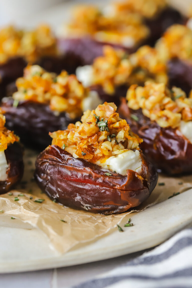 feta stuffed dates on a serving tray