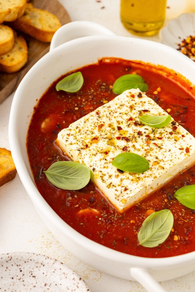 side angle of baked feta in marinara