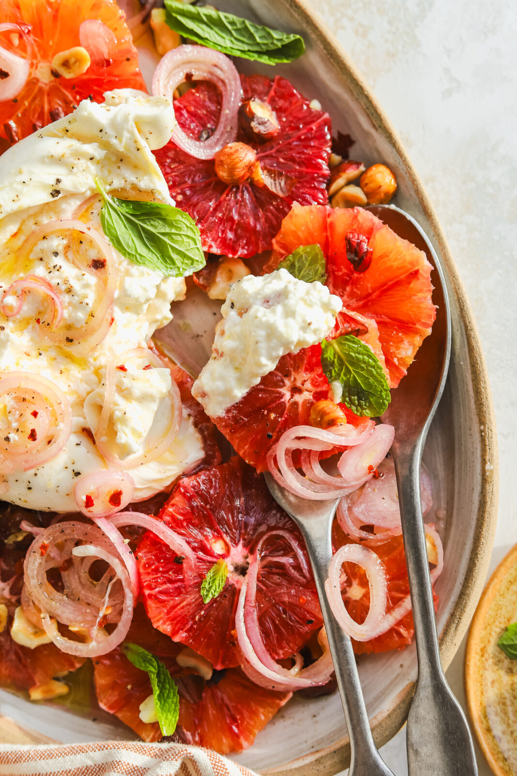 blood orange salad on serving spoons